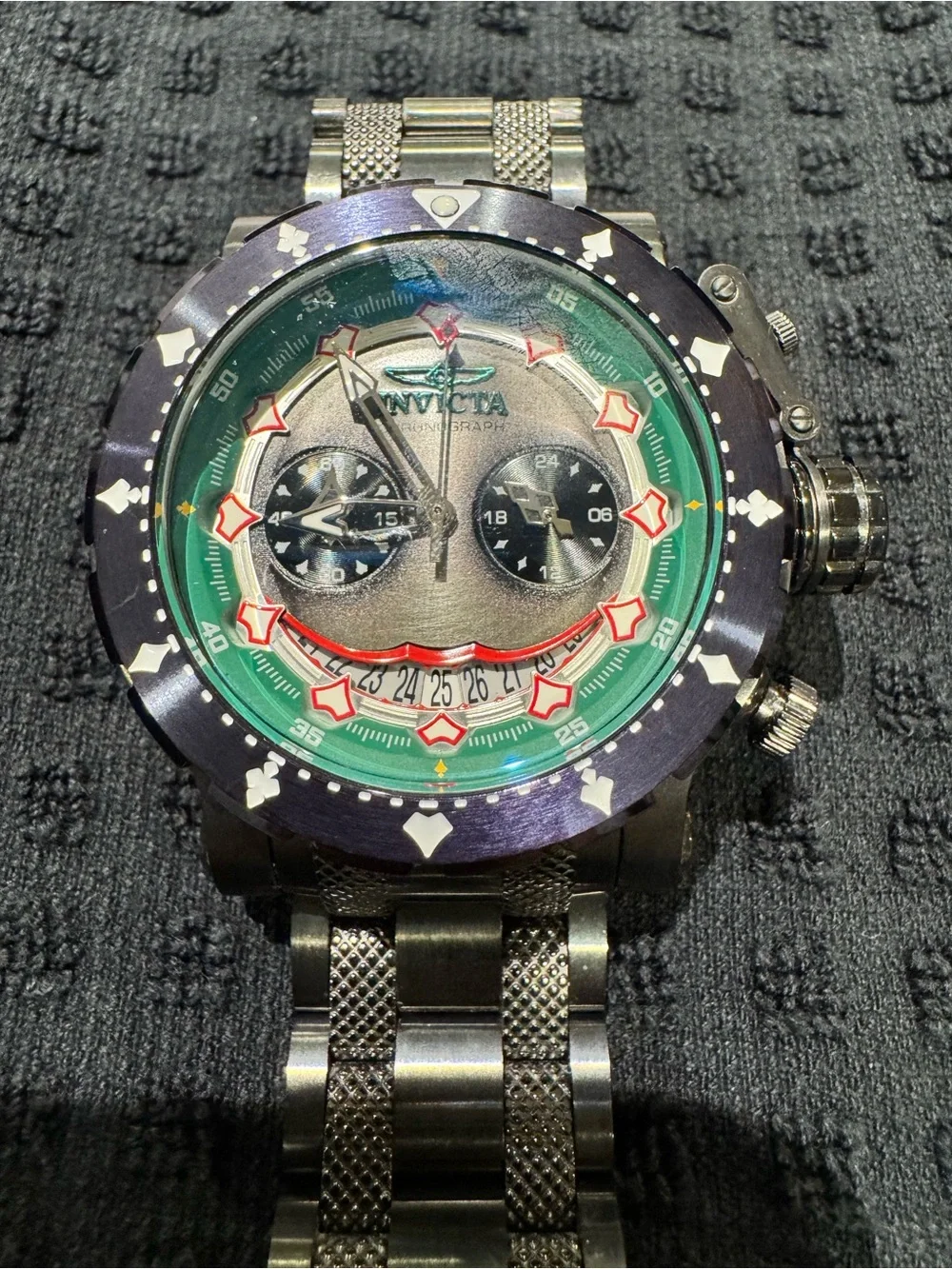 Invicta Silver and Green Chronograph Watch with Red Accents